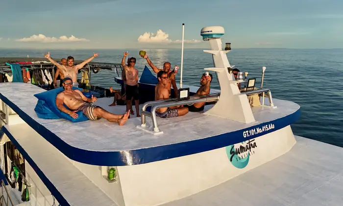 Guests relaxing on the shaded top deck